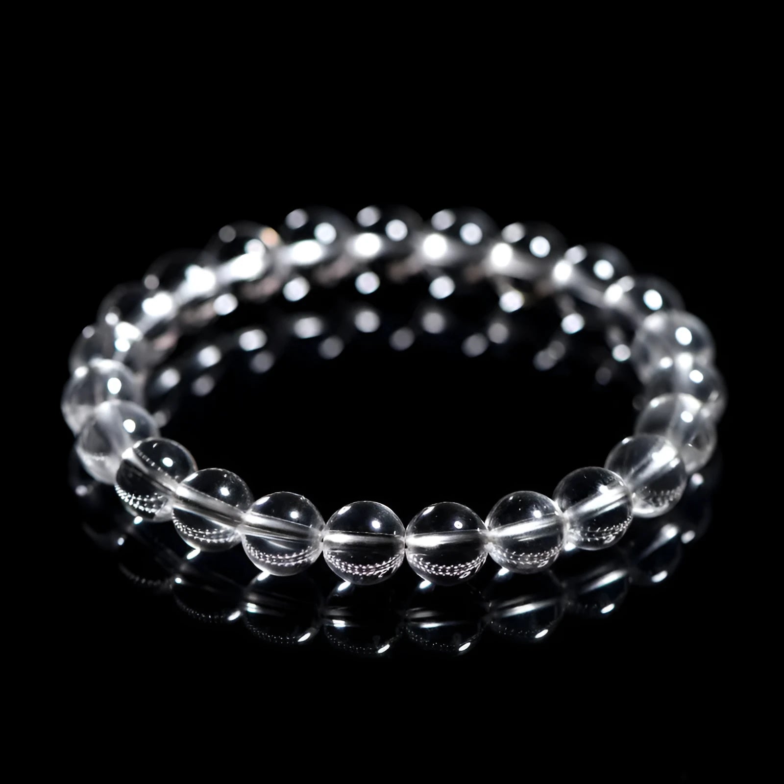 Natural old mine white crystal round bead bracelet with geometric style on a wrist.