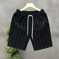 Men's black and white striped casual polyester shorts with an elastic waistband.