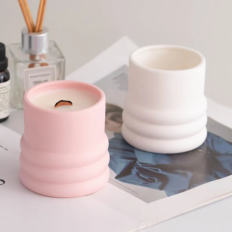 Minimalist ceramic round candlestick with relief pattern on a dining table