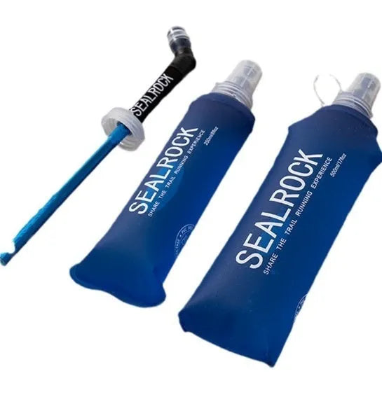 Close-up of a grey flexible plastic hydration straw with a textured grip and a blue silicone cap for mountain biking