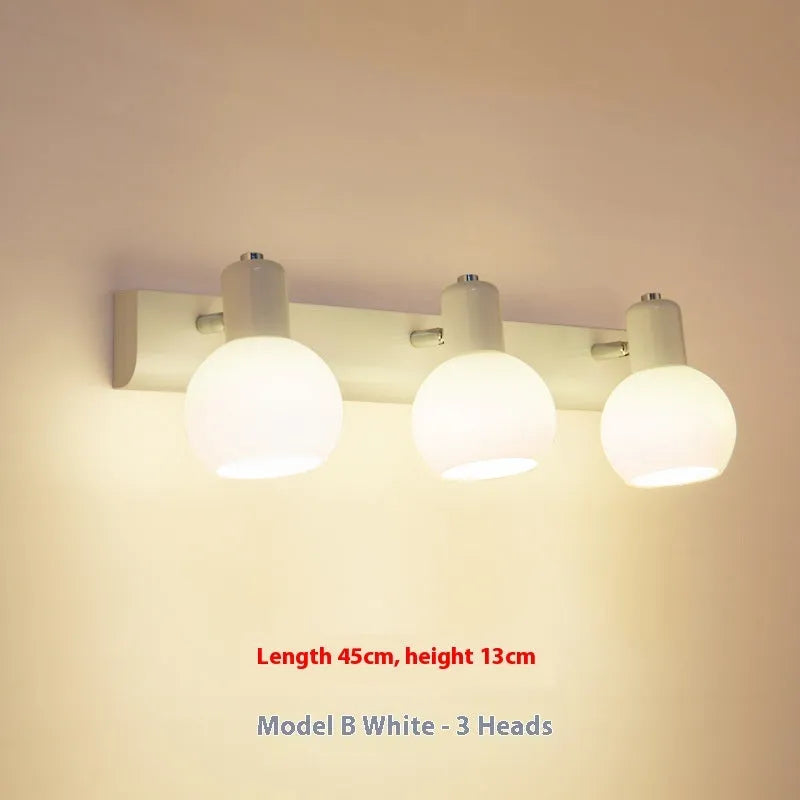 LED wall-mounted washstand mirror front lamp in American simple style, black finish, installed above a bathroom mirror
