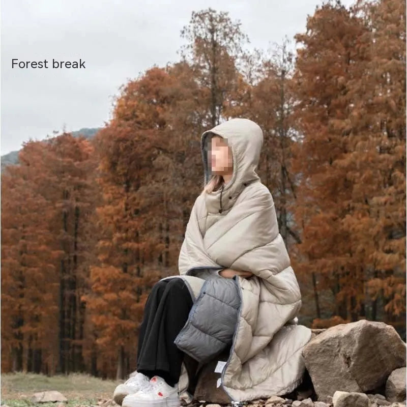 Outdoor cloak sleeping bag in grey or army green, showing wearable cape configuration and flat blanket layout
