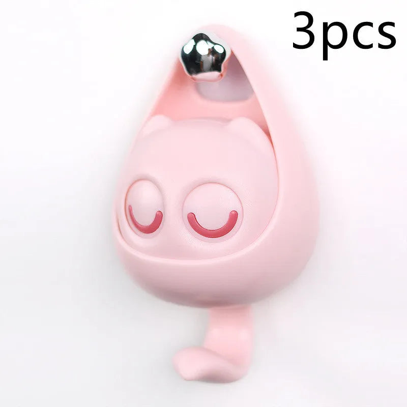 Cream white cat-shaped adhesive wall hook with winking eyes, 2.5kg capacity, 105x61x45mm
