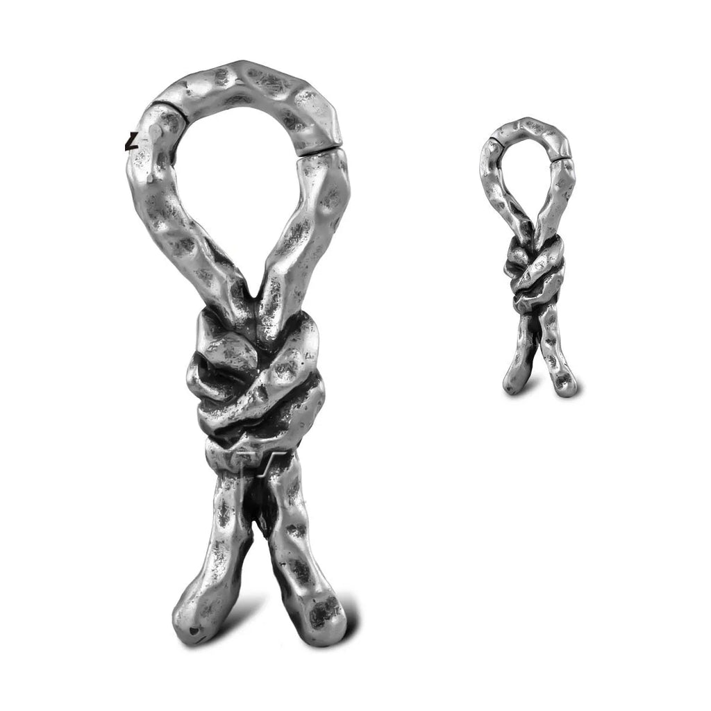 Close-up of Creative Bends And Hitches copper cartilage earrings with a 4mm gauge and retro bending design.