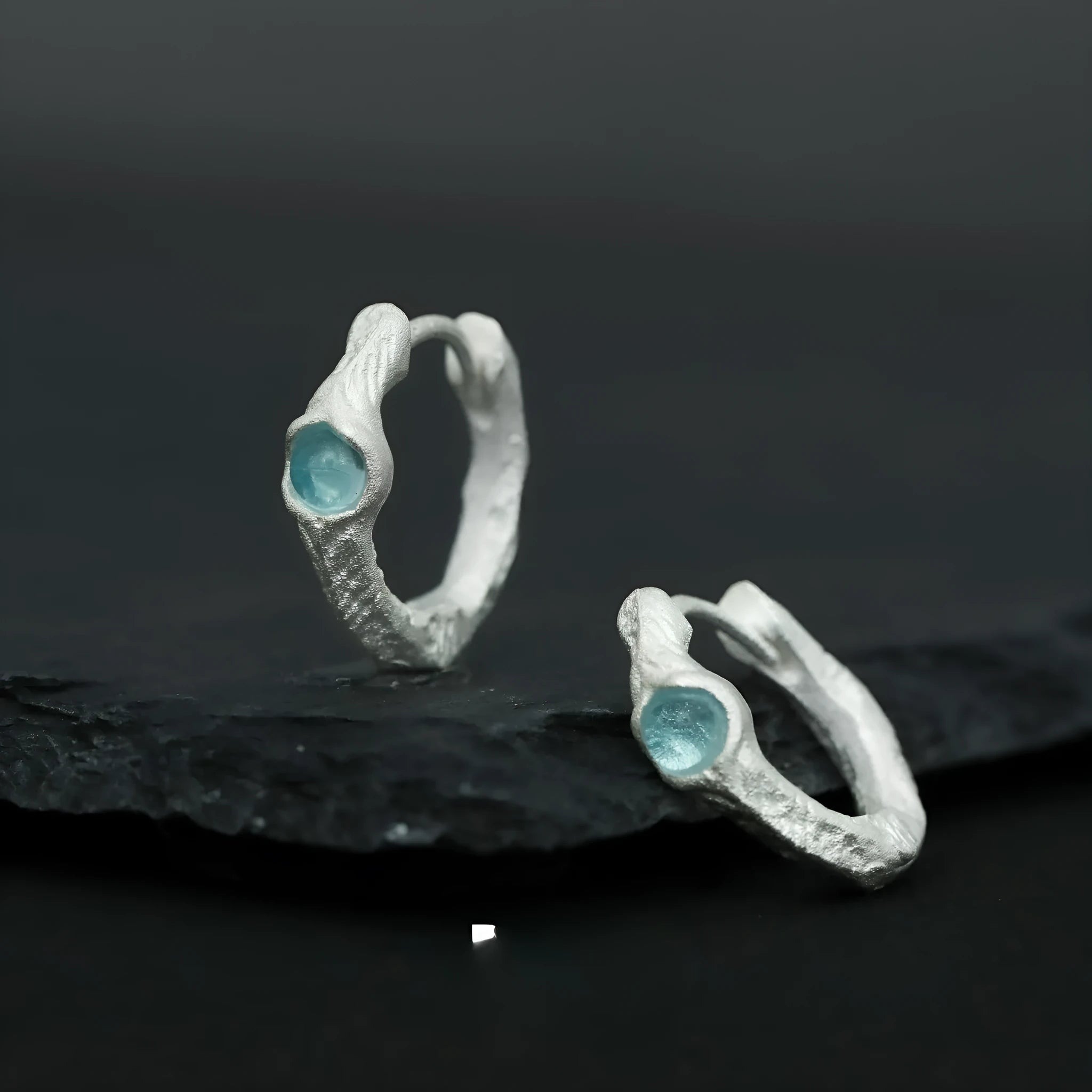 Geometric circle ear clip in burnt silver finish made from 925 sterling silver