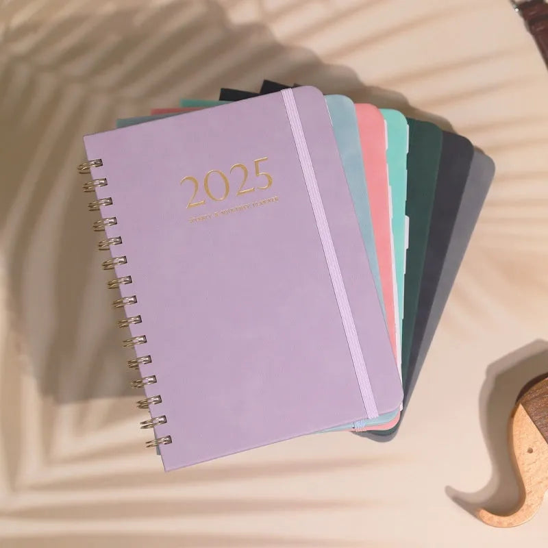 A5 leather notebook with metal coil binding in multiple colour options including black, blue, brown and green