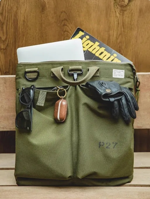 Retro military green canvas messenger bag with crossbody strap and zipper closure