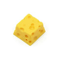 Yellow resin cheese keycap for mechanical keyboards with 3D design detail