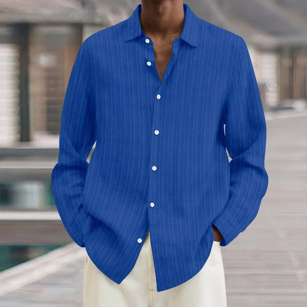 A man's loose-fit striped cardigan shirt with long sleeves in a British style design.