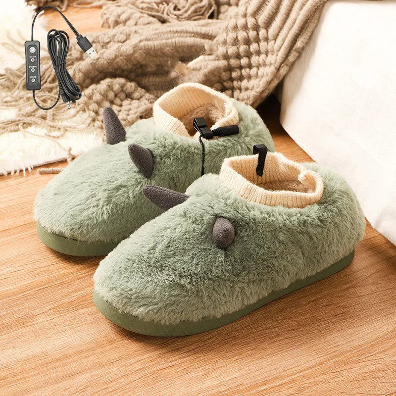 USB electric foot warmer slippers in grey with a connected USB cable on a wooden floor.