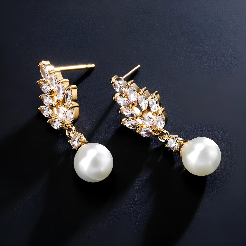Gold plated geometric earrings with micro inlaid zircon stones in a floral design.