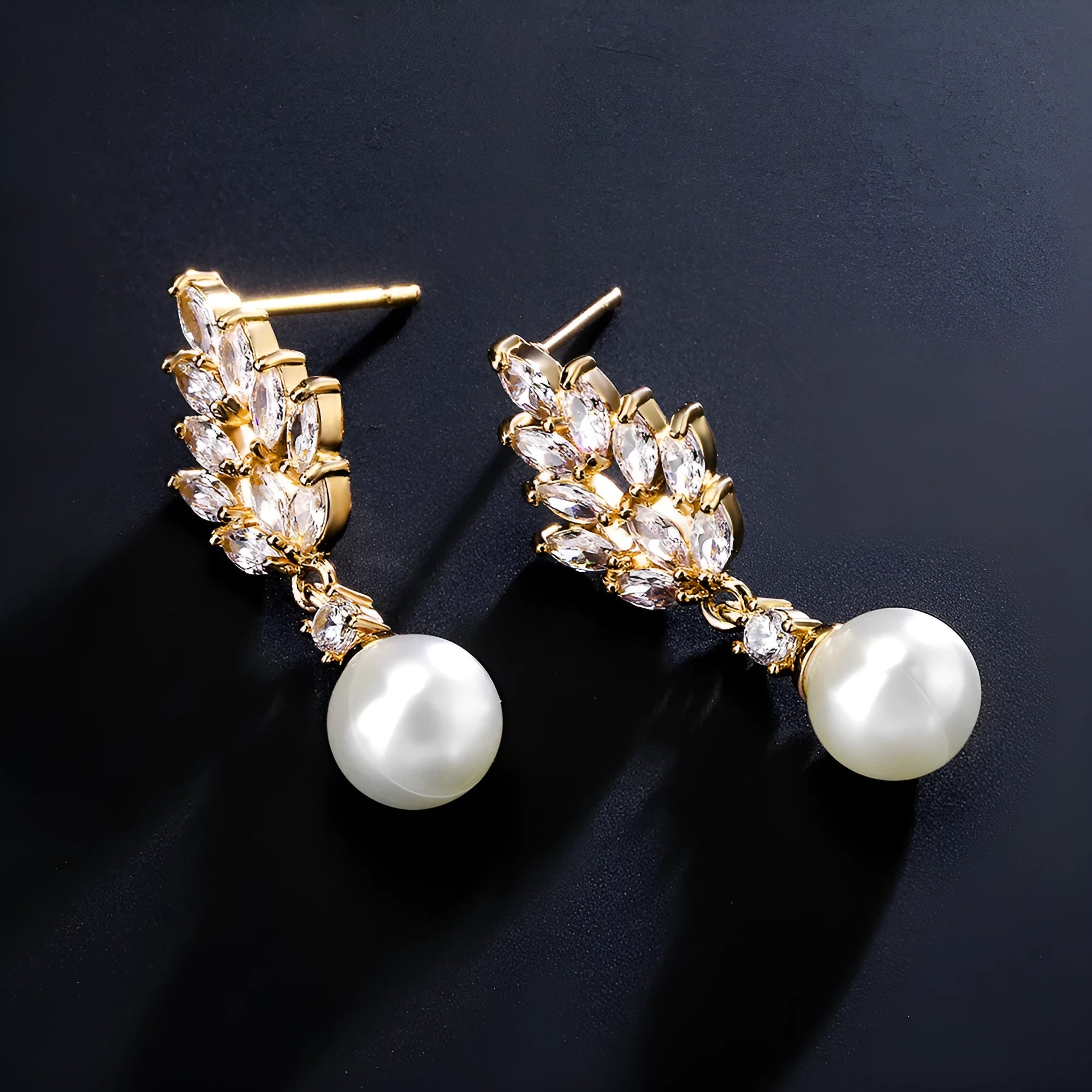 Gold plated geometric earrings with micro inlaid zircon stones in a floral design.