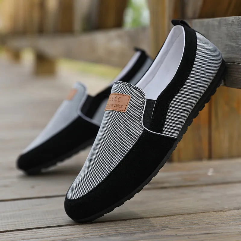 Men's grey and khaki canvas casual board shoes with round toe and rubber sole.