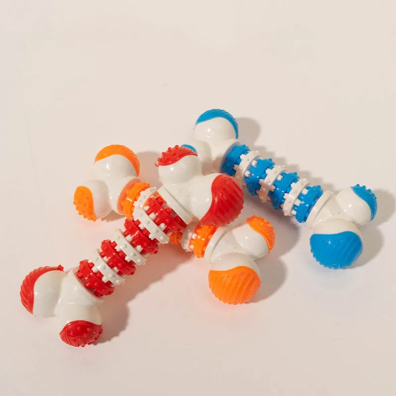 Blue, orange, and red bone-shaped interactive chew toy with treat holder for small breed dogs.