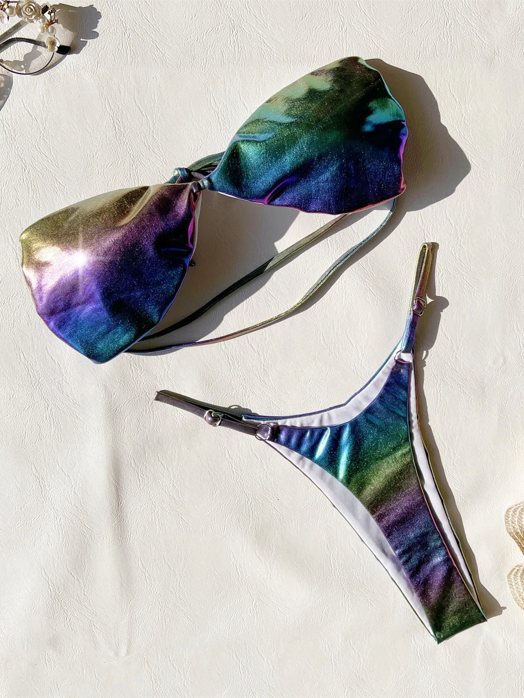 Women's purple gradient two-piece bikini swimsuit set on a mannequin.