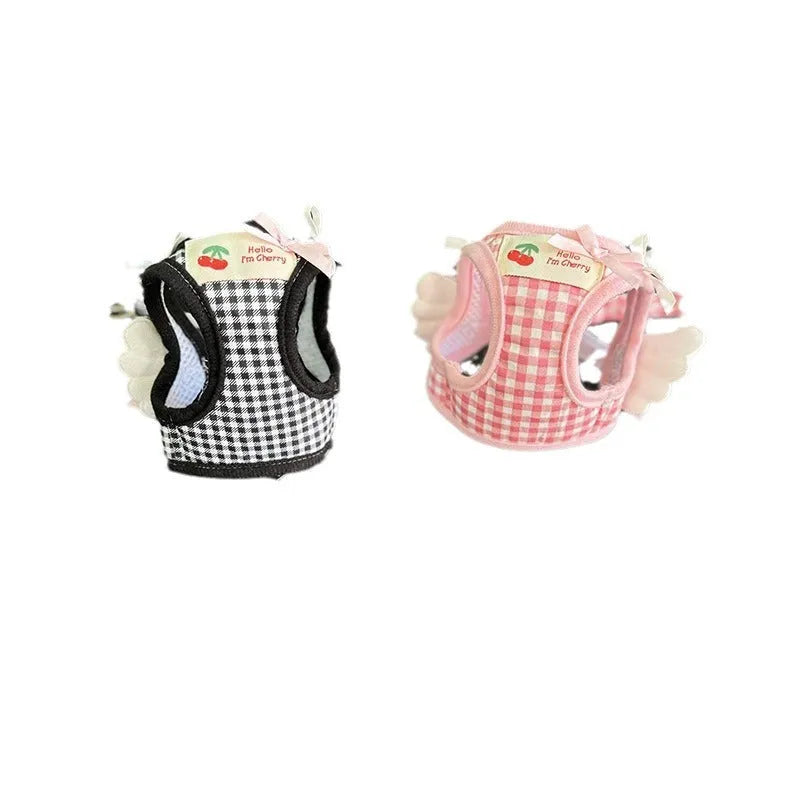 Pink cotton harness and lead set for a small dog with chest and back attachment points.