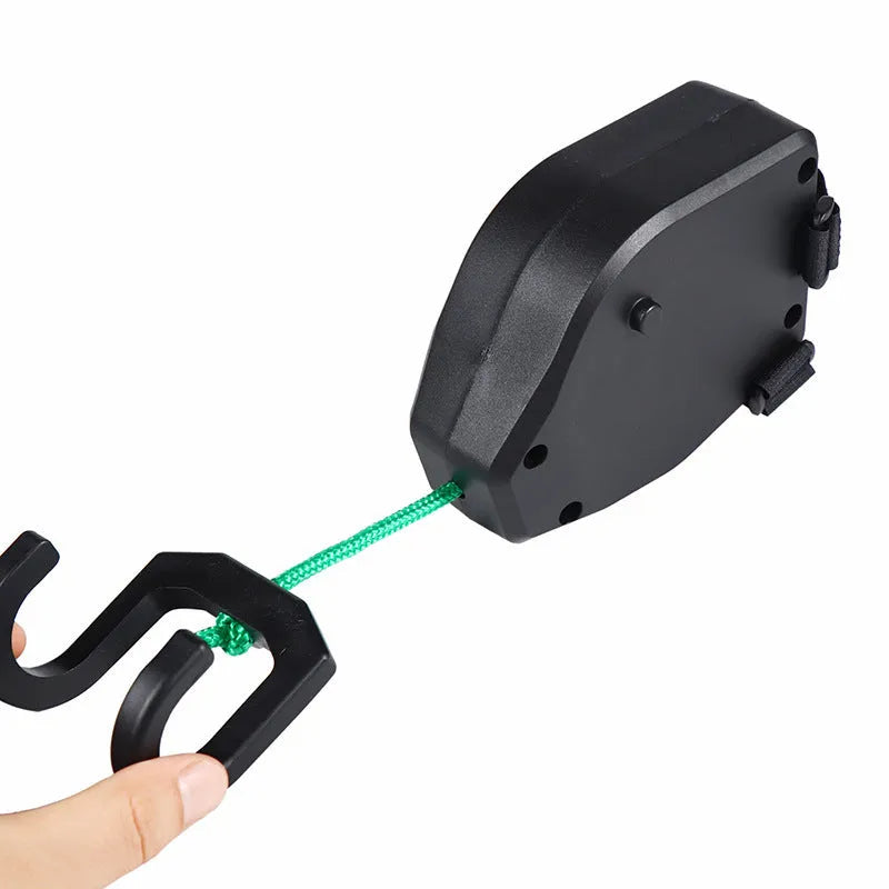 Black plastic and resin bicycle trailer rope for connecting a child's trailer to an adult bike.