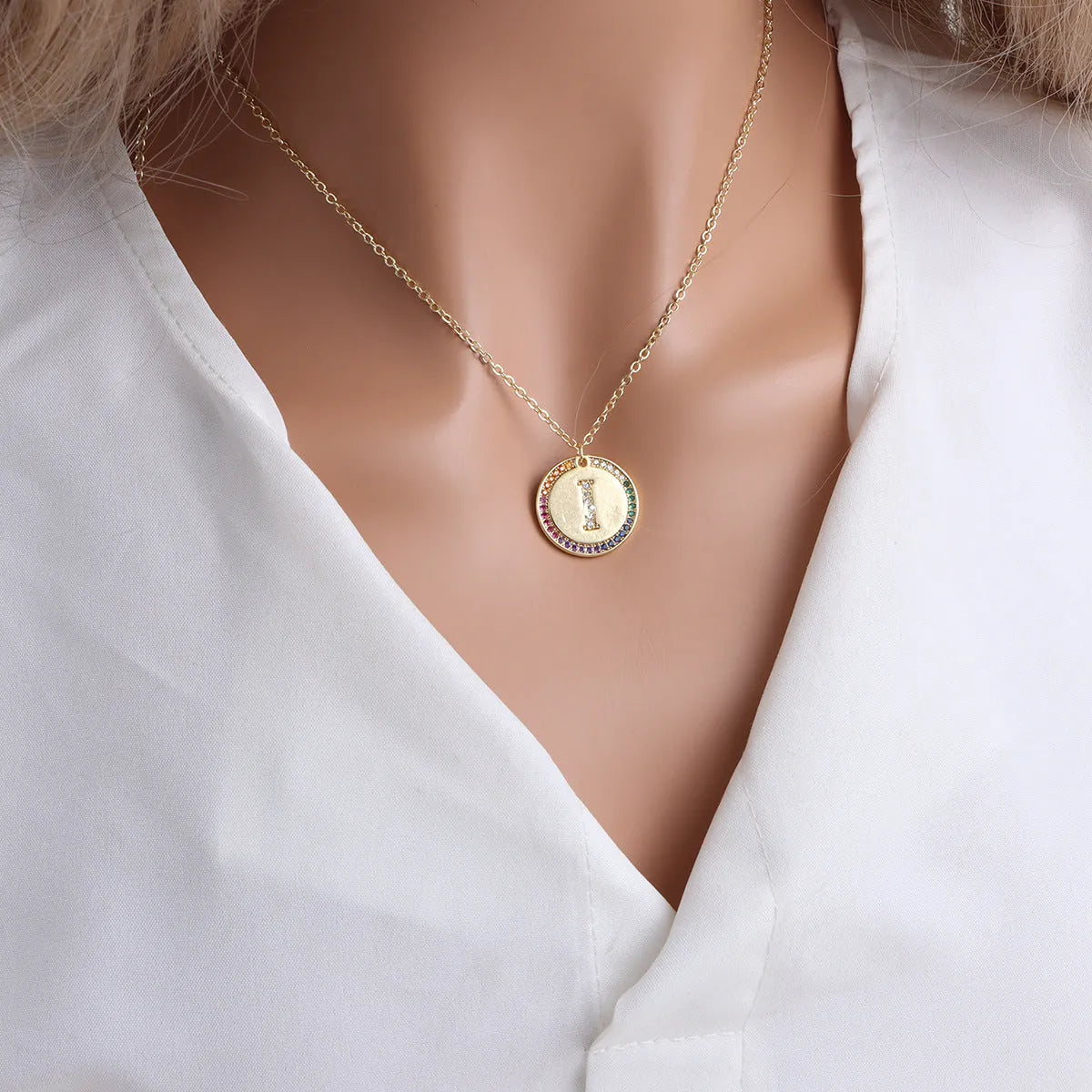 Gold English letter round pendant necklace with colourful crystals on clavicle length chain