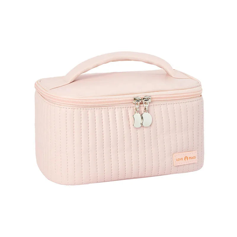 Open-top women's makeup bag in PU leather, shown in a choice of solid colours including pink, beige, and light blue.