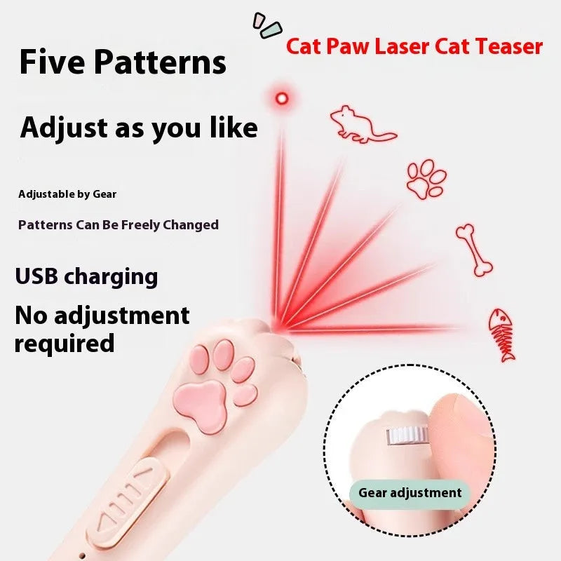 Pink automatic cat teaser toy with a wand attachment on a hardwood floor, showing compact circular base.