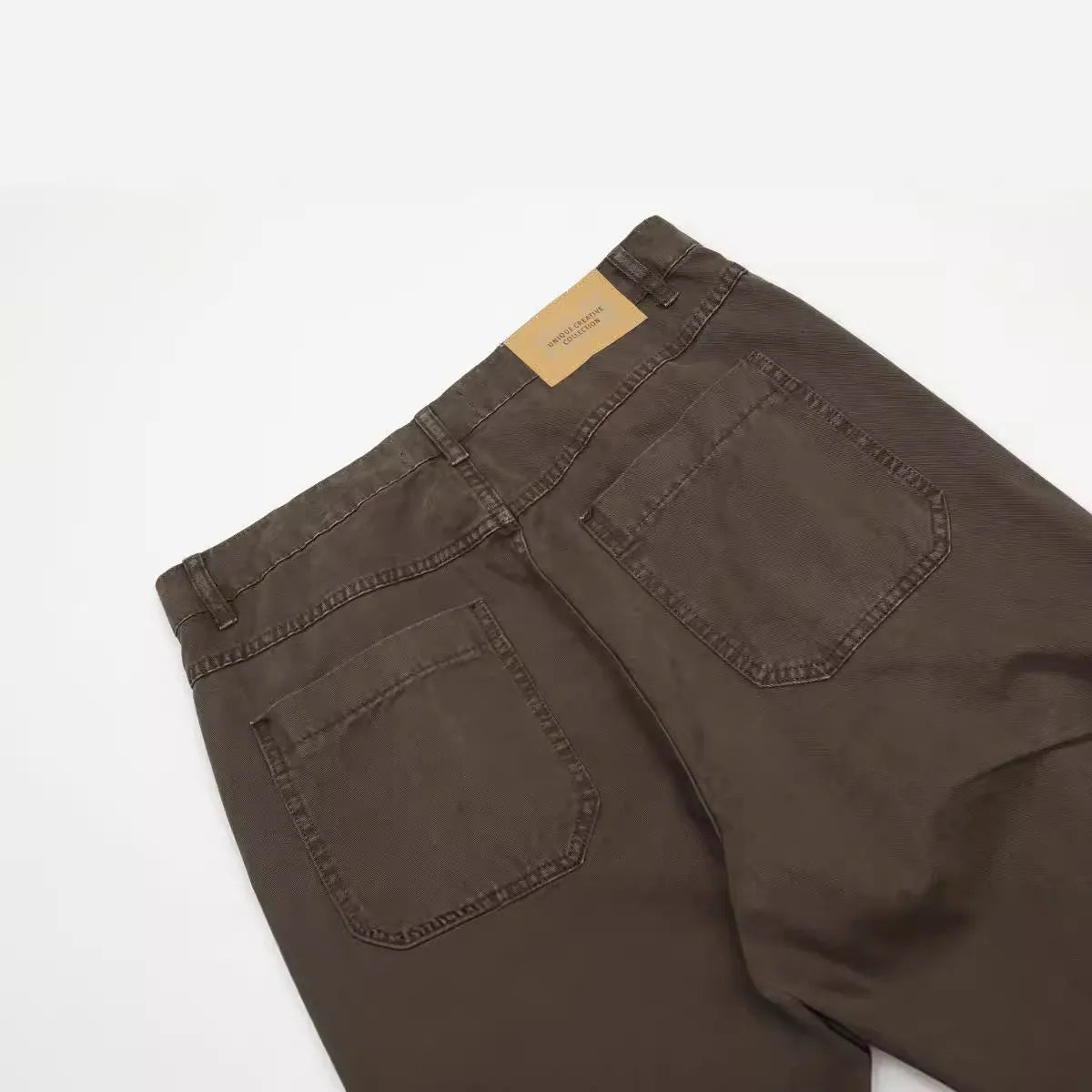 Men's brown loose straight leg trousers with high waist and zip fly
