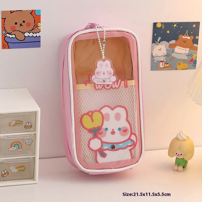 Transparent PVC pencil case with large capacity, featuring a cute Korean-style cartoon bear design.