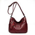 Genuine leather cross-body messenger bag in horizontal square shape with internal organisers