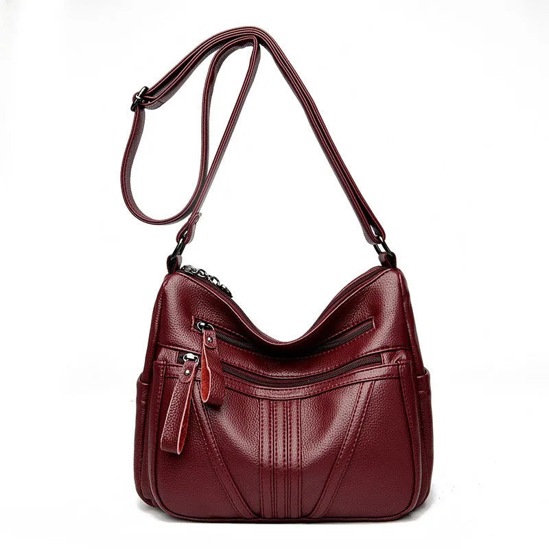 Genuine leather cross-body messenger bag in horizontal square shape with internal organisers