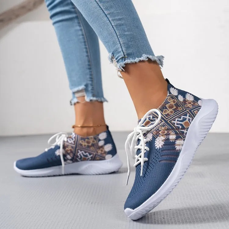 Women's woven flat casual sneakers in green with mesh upper, round toe, front lace-up, and rubber sole