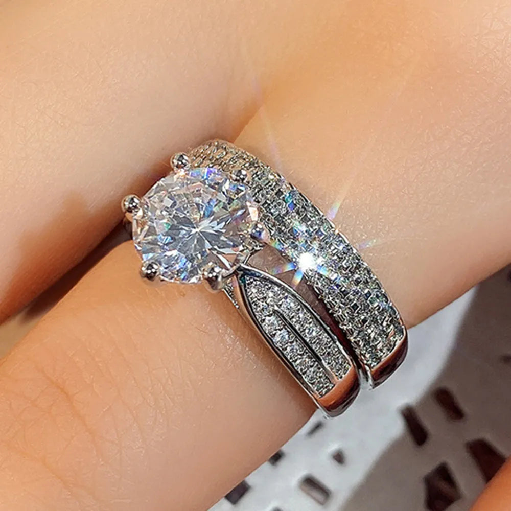 Geometric style wedding ring paired with a matching simple bracelet band in a white gold colour finish.