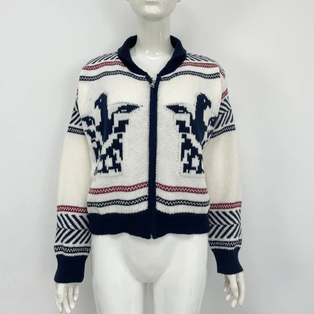 White women's zip-front cardigan with lapel collar and contrasting jacquard stripe pattern.