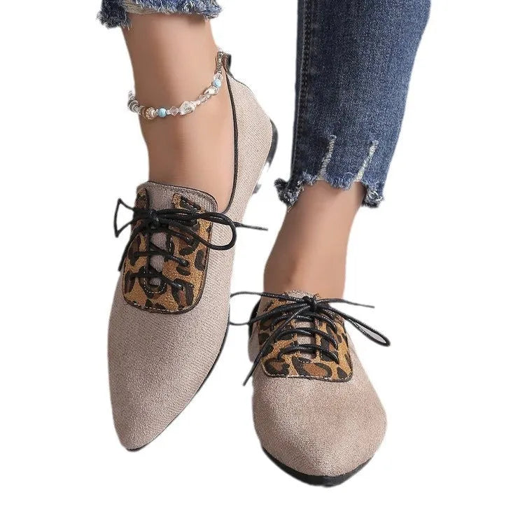 Beige leopard print women's pointed toe pumps with a rubber sole, shown in an extended size range.