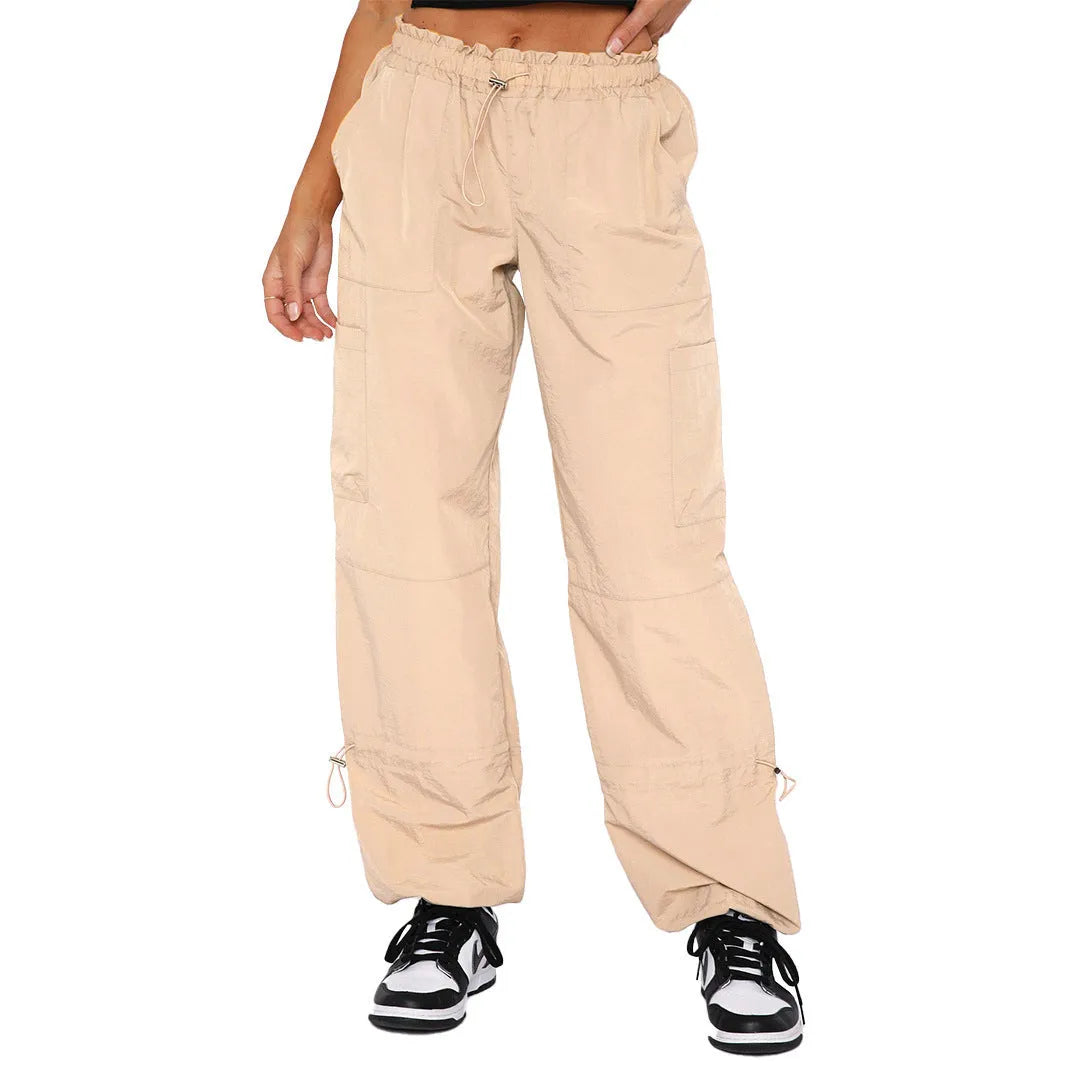Man's loose-fit straight-leg cargo pants in polyester, shown in a choice of colours including khaki and grey.