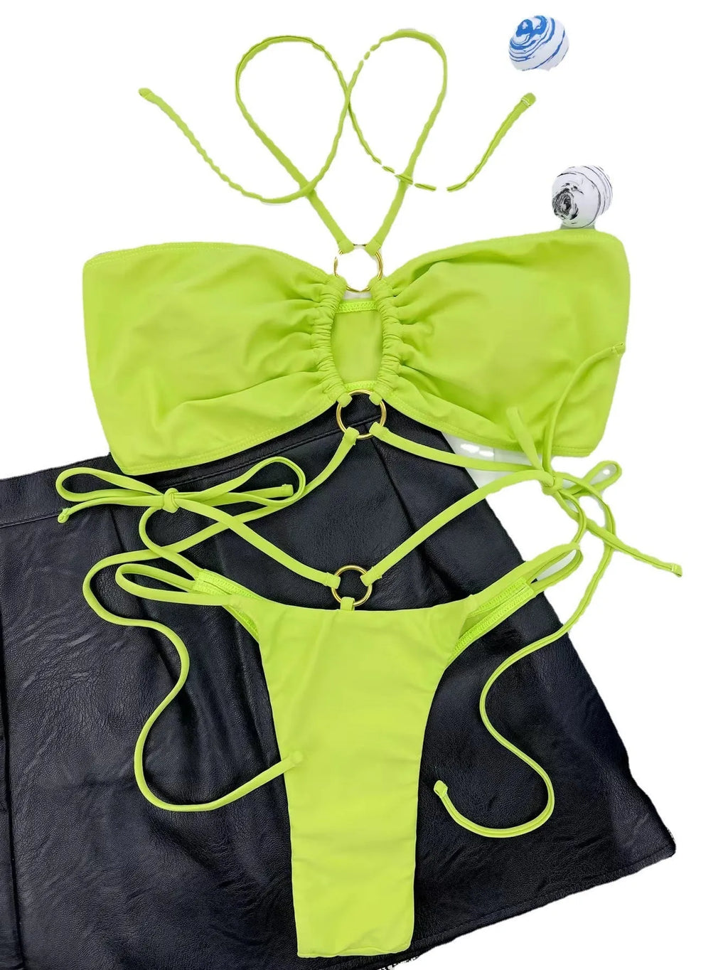 Women's yellow green lace-up triangle bikini swimsuit on mannequin