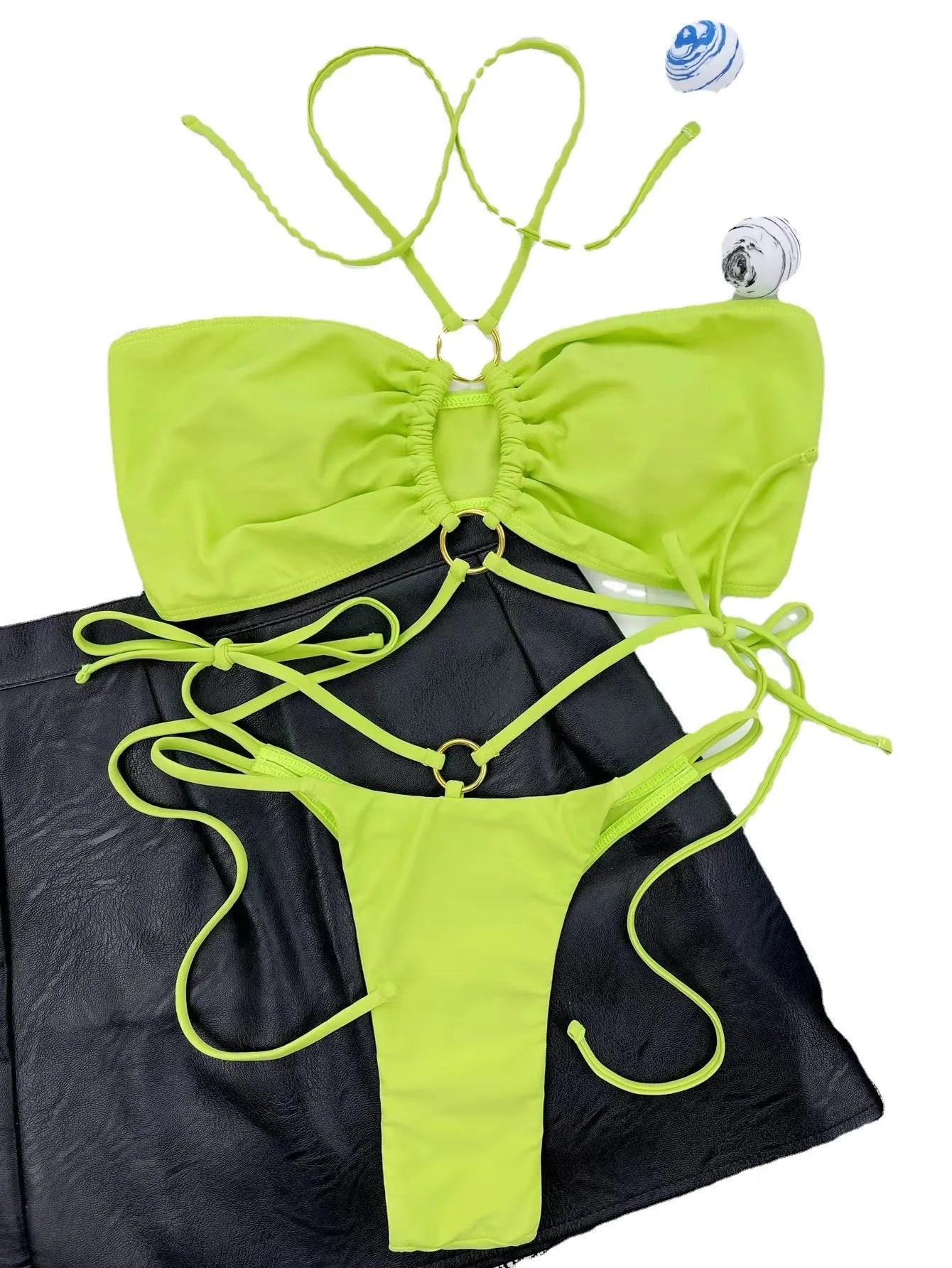 Women's yellow green lace-up triangle bikini swimsuit on mannequin