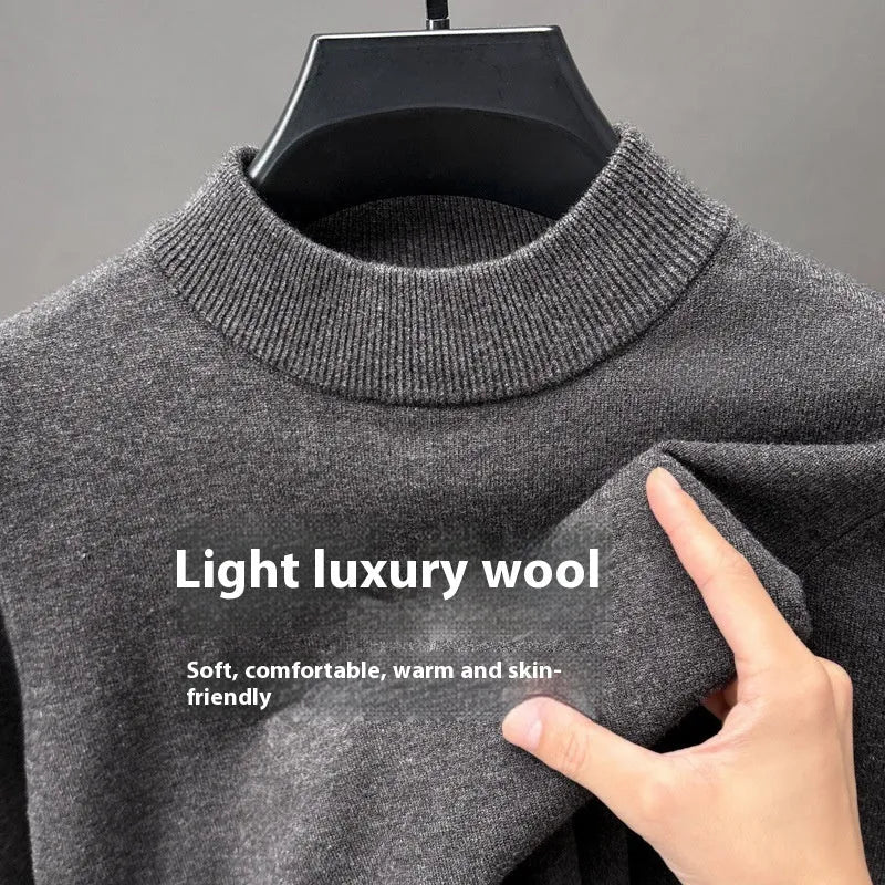 Men's fine wool half turtleneck sweater in a solid colour, showing long sleeves and regular fit.