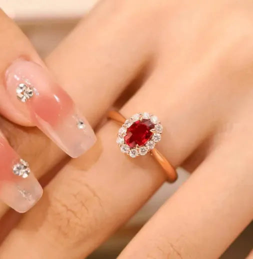 Gold pigeon motif women's ring with red blood ruby artificial gemstone and floral design in silver and gold plating