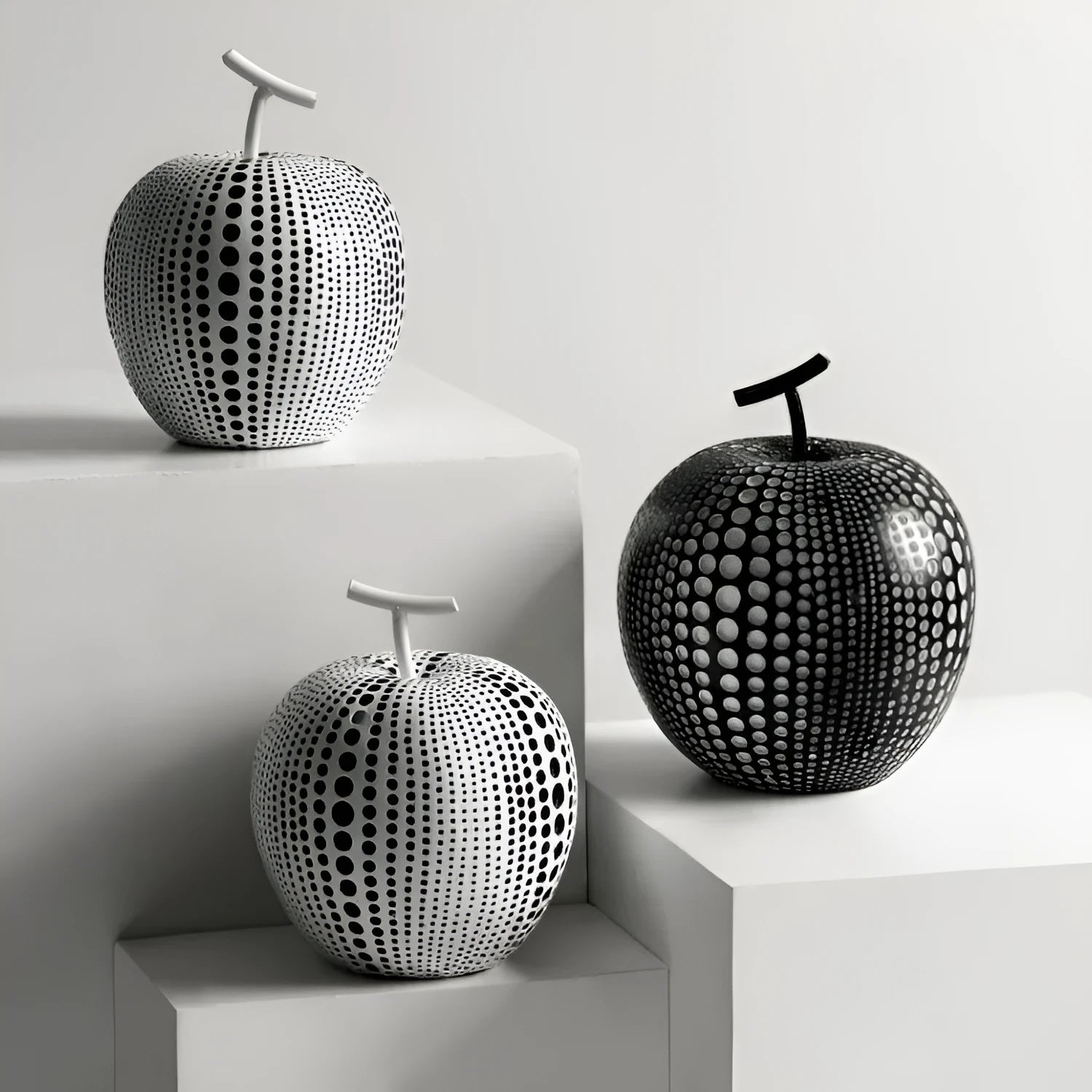 Resin apple sculpture in black, 17cm tall, smooth resin finish