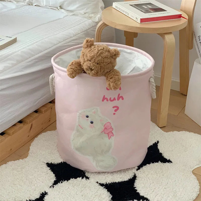 Foldable cotton cloth laundry basket in a character print colour, shown unfolded for use.