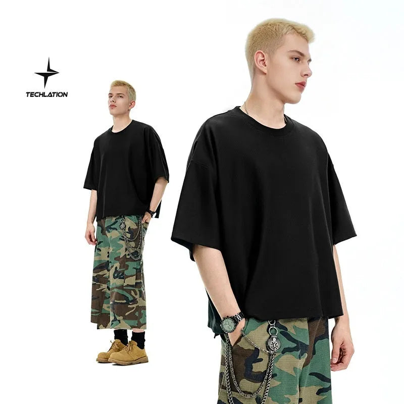 Man wearing a loose-fit Sand Grey short sleeve t-shirt made from cotton-polyester blend.