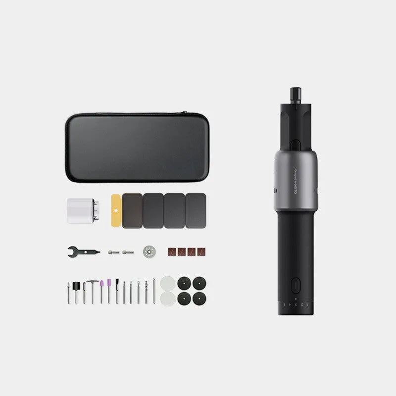 Black hand held rechargeable grinder with USB cable and accessory kit on workbench