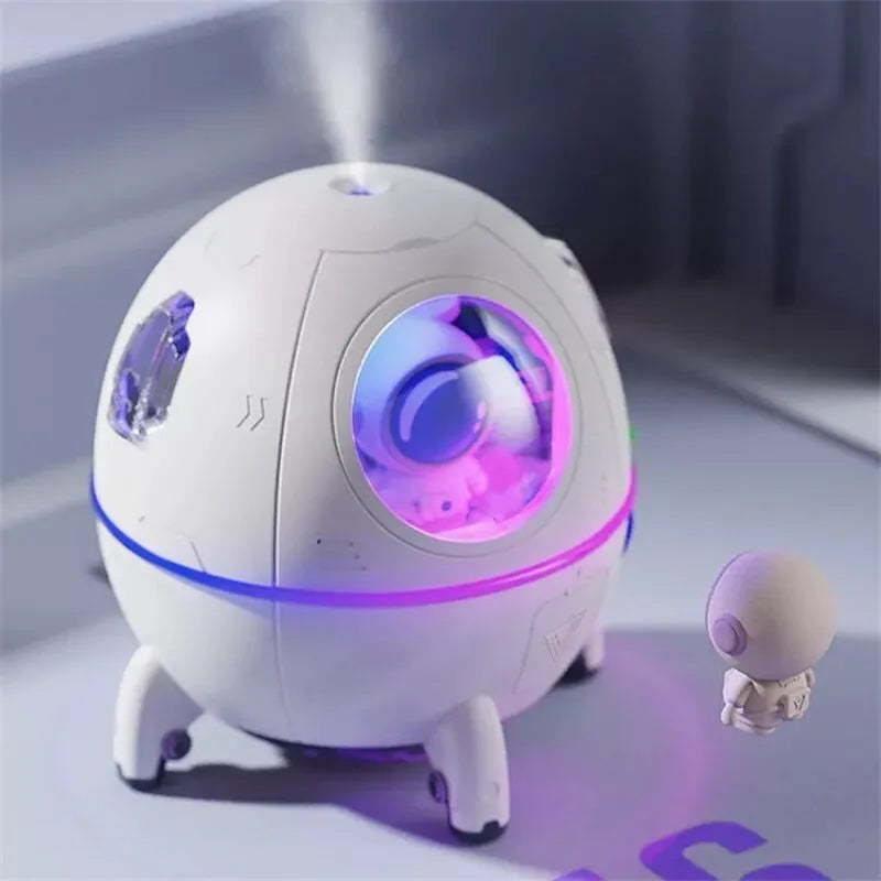 Purple astronaut-shaped USB desktop humidifier with colourful LED light on
