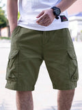 Men's army green cotton blend workwear shorts with a loose fit and retro style on a hanger.