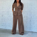Brown men's slim fit polyester two-piece suit with long sleeve top and matching trousers