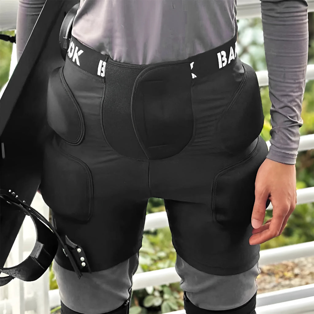 Black spandex hip protection pants with removable NBR foam padding for roller skating and skateboarding safety.