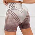 Women's high-waisted gradient fitness shorts in brown and black colours for yoga and running