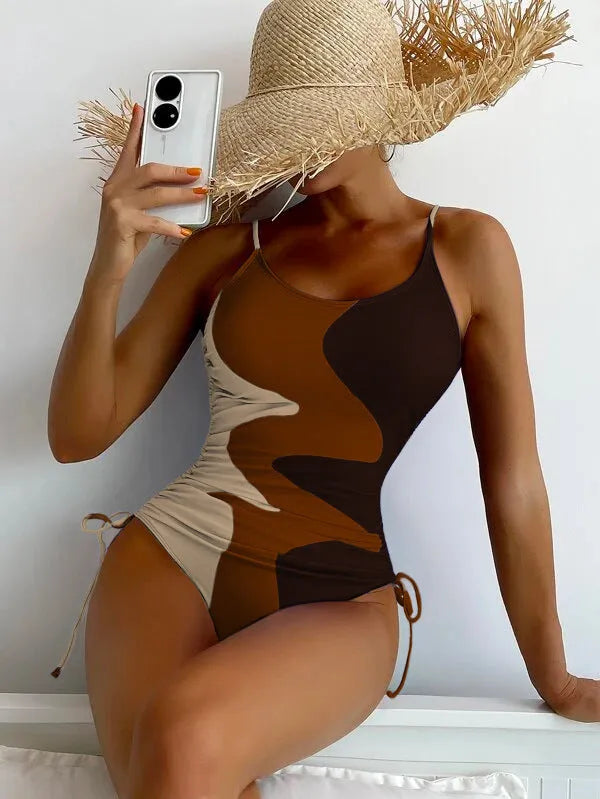 Women's blue sleeveless one-piece swimsuit with fixed trunks and backless design for swimming sports
