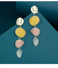Sterling silver alloy Morandi three-colour oil drip simple wafer disc earrings on a white background.