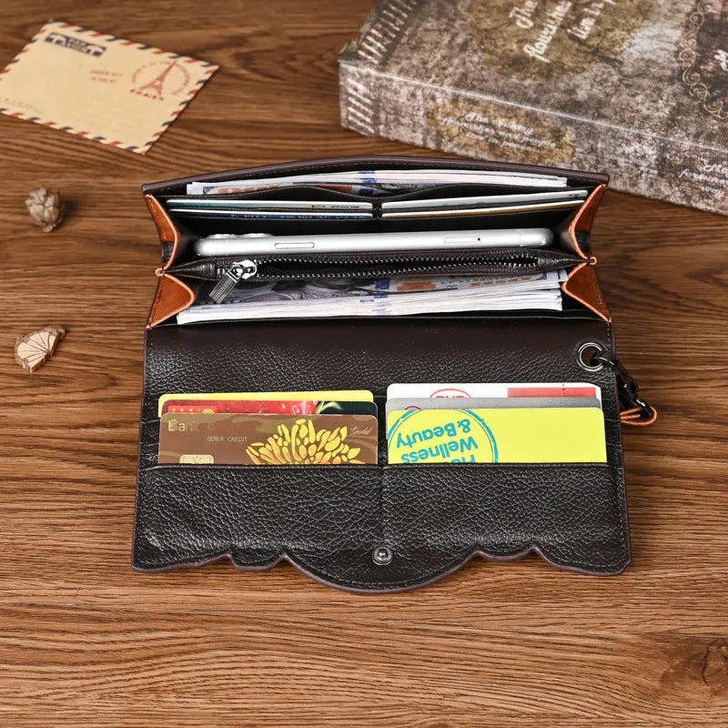 Retro brown women's tri-fold wallet with embossed floral pattern, showing interior card slots and coin compartment.
