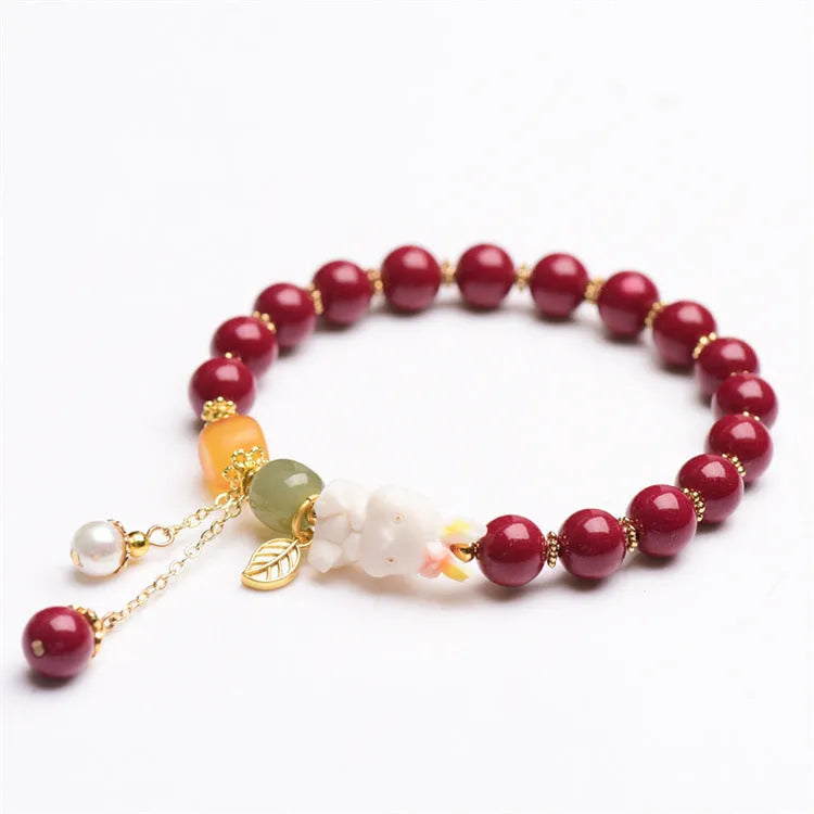 Traditional Chinese cinnabar bracelet with rabbit design in 8mm and 10mm bead size options.